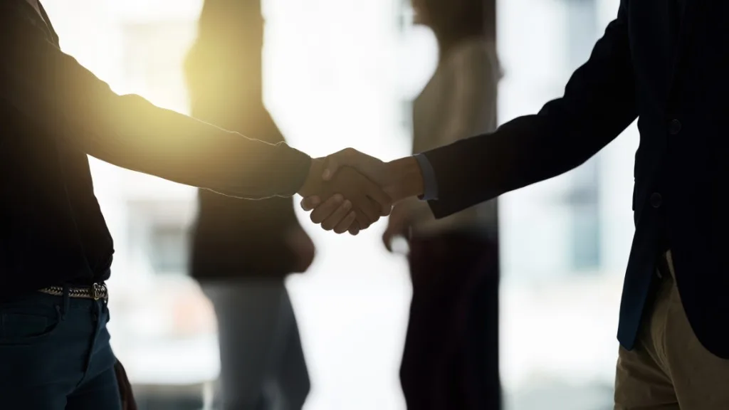 Professional handshake representing partnership and opportunity